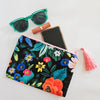 Assorted printed zip clutch