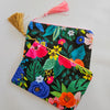 Assorted printed zip clutch