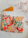 Assorted printed zip clutch